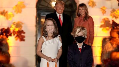 Children dressed as U.S. President Donald Trump and U.S. first lady Melania Trump attend a Halloween event hosted by President Trump and the first lady at the White House in Washington, U.S. REUTERS