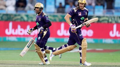 Quetta's Shane Watson (R) and Umar Akmal take a quick single.