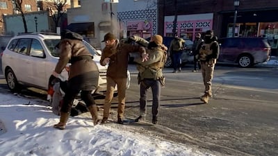 A federal law enforcement officer sprays irritants at Alex Pretti before he was fatally shot by federal agents during an immigration enforcement operation in Minneapolis, Minnesota on Saturday. Reuters