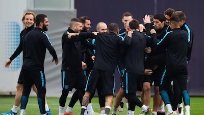 Munir El Haddadi is mobbed by teammates during a Barcelona training session. David Ramos / Getty Images