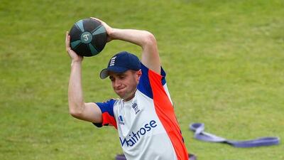 England bowler Chris Woakes stretches during the training session.