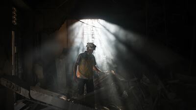 A member of Syria's civil defence works in the aftermath of an Israeli air strike on Syria's defence ministry headquarters in Damascus, Syria. Getty Images