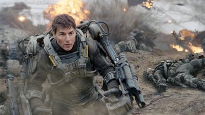 Tom Cruise plays a cowardly US army officer who is forced into combat in Edge of Tomorrow. Warner Bros Pictures / AP Photo