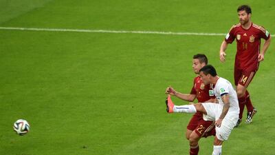 Chile midfielder Charles Aranguiz shoots and scores his team's second goal in the 2-0 win over Spain on Wednesday at the 2014 World Cup. Yasuyoshi Chiba / AFP
