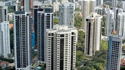 London, New York, Singapore and Hong Kong have benefited most from cheap money policies adopted by central bankers. Above, residential housing in Singapore. Roslan Rahman / AFP