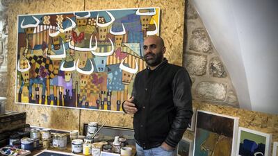 Ayed Arafah paints bulls in everyday situations as a retort to the stereotype that Palestinians are fighters. Heidi Levine for The National