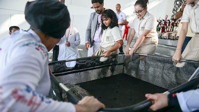 School children attended the ceremony to take part in the turtles' release