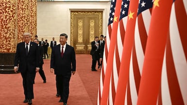 China's President Xi Jinping and US President Donald Trump arrive to attend a state banquet at the Great Hall of the People in Beijing. AFP