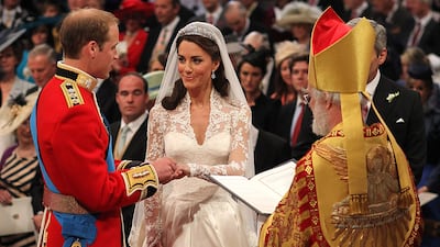 Prince William exchanges rings with his bride in front of the Archbishop of Canterbury Rowan Williams during their wedding ceremony at Westminster Abbey in April 2011
