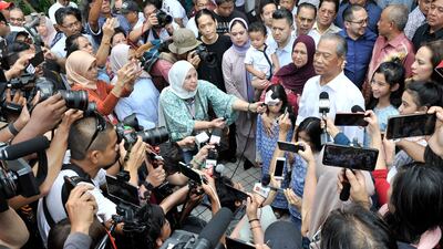 Politician Muhyiddin Yassin talks to media outside his house after he being appointed as new prime minister in Kuala Lumpur, Malaysia, Saturday, Feb. 29, 2020. AP