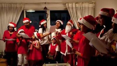 A group of young residents of the Al Maskan building went around to their neighbours apartments to sing Christmas carols and raise money for Philippine typhoon victims in Dubai. Christopher Pike / The National