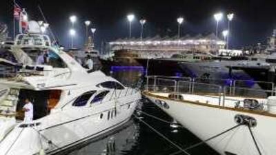 F1 fans watch the F1 Formula race from yachts at the YAS Yacht Marina.