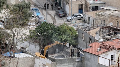 Israeli forces use excavators to demolish a house belonging to a Palestinian family in the Al Bustan area of the Silwan neighbourhood in East Jerusalem on April 15, 2026. AFP