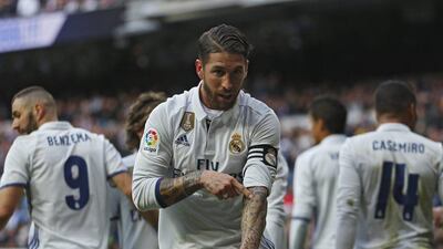 Sergio Ramos celebrates after scoring his and Real Madrid's first goal in the 2-1 win over Malaga on Saturday. Francisco Seco / AP Photo