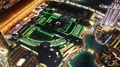 The Dubai Mall, illuminated by green lights, is seen as a powerful example of the "competencies that Emaar has developed in retail".Gabriela Maj / Bloomberg News