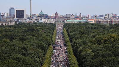 A general view shows a protest near the Brandenburg Gate against the government's restrictions amid the coronavirus disease (COVID-19) outbreak, in Berlin, Germany. REUTERS