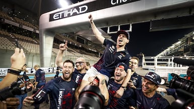 Max Verstappen celebrates with his Red Bull team after winning the F1 title at the Abu Dhabi Grand Prix at Yas Marina Circuit. Getty Images
