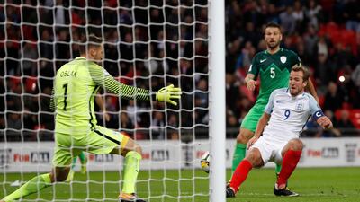 Harry Kane, right, scores the only goal of the game for England against Slovenia at Wembley Stadium. Kirsty Wigglesworth / AP Photo