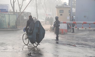 An Afghan soldier secures the area outside the gate of a government building a day after a complex suicide attack in Kabul, Afghanistan, 25 December 2018. EPA