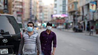 People walking on the streets in Al Ras area in Deira Dubai. Pawan Singh / The National