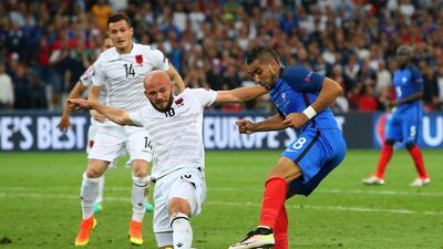 Dimitri Payet, right, of France takes on Arlind Ajeti of Albania. Alec Livesey/ Getty Images.