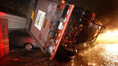 An overturned lorry crashes into a house in the Dallas/Fort Worth area.