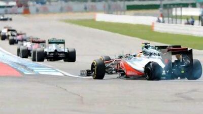 McLaren Mercedes' British driver Lewis Hamilton drives with a flat tire at the Hockenheimring circuit on July 22, 2012 in Hockenheim during the German Formula One Grand Prix. AFP PHOTO / PATRIK STOLLARZ *** Local Caption *** 040016-01-08.jpg