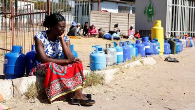 A woman waits to buy gas at a service station in Harare, Zimbabwe, July 16, 2019. Reuters