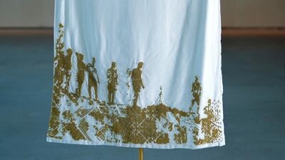 ‘My Journey’ thobe is focused on the mental journey of the boys about to leap from Akka’s cliffs. This is about the internal monologues which must be taking place as the boys stand waiting and contemplate the dangerous feat. To the top right there is a brass sculpture of one young man suspended in mid-air. Victor Besa/The National