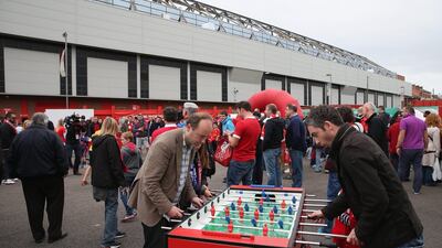 Liverpool supporters play foosball outside Anfield. Getty Images