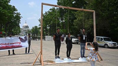 Activists take part in a demonstration to raise awareness of global warming, during an event to mark World Environment Day in Kolkata. AFP