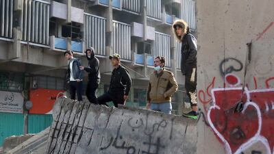 Iraqi anti-government protesters keep watch at Al Sinek bridge in the capital Baghdad. AFP