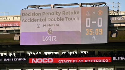 Big-screen at Selhurst Park explains the VAR decision to make Jean-Philippe Mateta retake his penalty for Crystal Palace. AFP