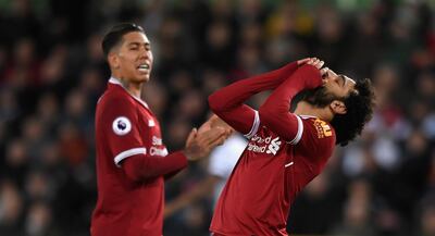 Liverpool's Roberto Firmino, left, and Mohamed Salah will look to bounce back to form against West Bromwich Albion. Stu Forster / Getty Images