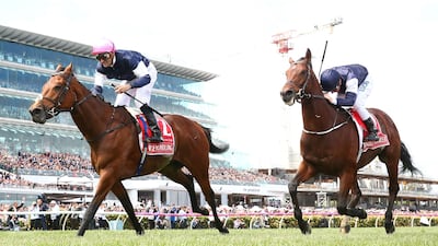 Corey Brown rides Rekindling, left, to victory in the 157th Melbourne Cup at Flemington Racecourse. Robert Cianflone / Getty Images