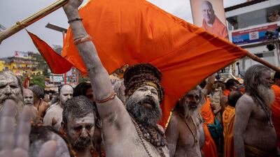 Naga Sadhus, or Hindu holy men, leave after taking a dip in the Ganges river during Shahi Snan at Kumbh Mela. Reuters