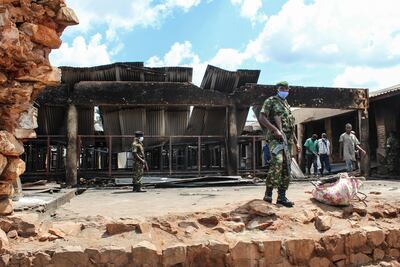 Security officers outside the ruins of the central prison in Gitega. AFP