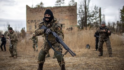 Ukraine's Territorial Defence Forces participate in firearm drills at a former asphalt factory on the outskirts of Kiev. Bloomberg