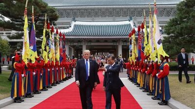 South Korean president Moon Jae-in and US president Donald Trump walk towards a guard of honour during a welcoming ceremony at the presidential Blue House in Seoul, South Korea. Chung Sung-Jun / EPA
