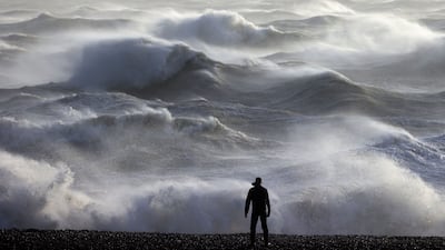 Waves crashing on the shore in Newhaven. AFP
