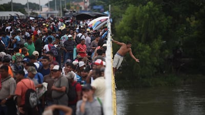 Some jump in the Suchiate River in a bid to make the crossing. EPA