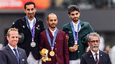 Abdullah Humaid Al Muhairi, top left, joins other riders on the podium after winning a silver medal in the Individual final. Photo: Supplied
