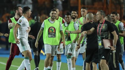 Algeria's Baghdad Bounedjah, left, celebrates with his teammates after scoring the opening goal. AP
