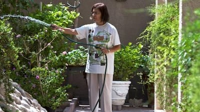 Deena Motiwalla, the founder of Dubai Garden Circle, waters the plants in her Jumeirah garden. The longtime resident serves as a kind of coach to other gardeners.