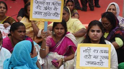 Indian women hold placards during a protest organised by Delhi Commission for Women in New Delhi, India, on April 13, 2018. Money Sharma / AFP