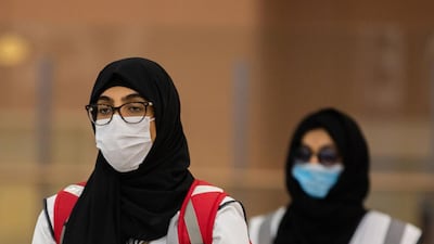 Members of the medical team from Saudi Health ministry await the arrival of Hajj pilgrims at Jeddah's King Abdulaziz International Airport. Saudi Ministry of Hajj and Umra / AFP