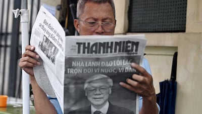 A man reads a newspaper reporting on Friday's death of Nguyen Phu Trong, the general secretary of the Communist Party of Vietnam. The results of Mr Trong’s approach might just be the envy of every foreign ministry in the Asia Pacific. AFP