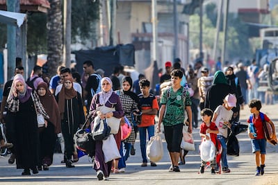 People flee from the eastern parts of Deir Al Balah to the city centre on June 8. AFP