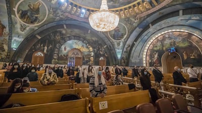 People pray during Christmas Mass at the Archangel Michael Coptic Orthodox Church. Egypt’s Christians account for 10 per cent of the country’s 102 million population. AFP