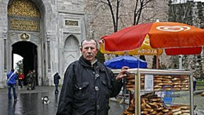 Riza Ece, 54, sells freshly baked simits that have been cooked in a traditional wooden oven.